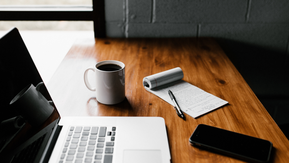 laptop and other things lay down at the table