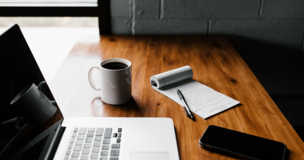 laptop and other things lay down at the table