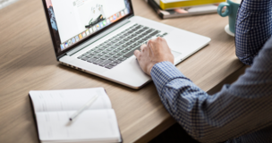 men writing something on the computer