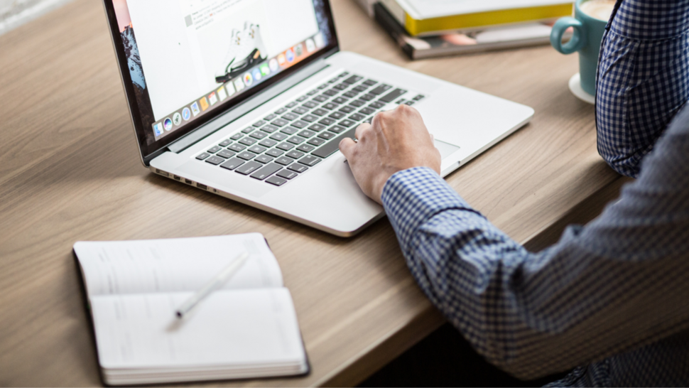 men writing something on the computer