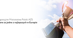 Obrazek przedstawia puchar trzymany w dłoni zwycięskiego sportowca.