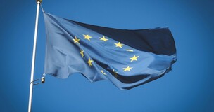 EU flag waving in the wind, promoting the “Denis de Rougemont” contest of the Blue Europe project.