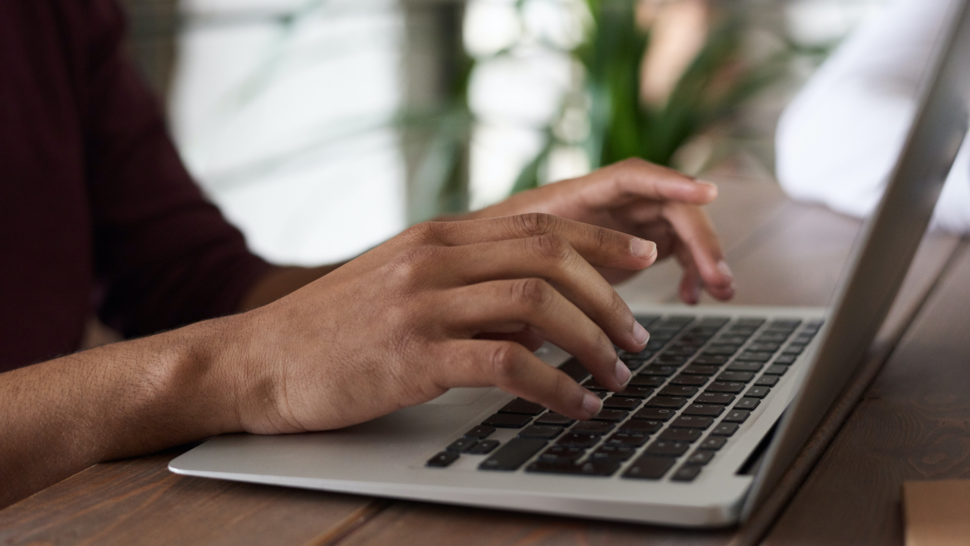 hands writing on the computer