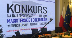 Stage with screen and award text announcing the IPiSS award for outstanding doctoral dissertation.