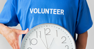 A man in a volunteer t-shirt 