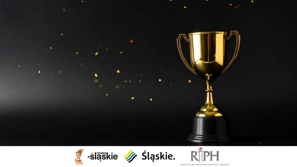 Złoty puchar w kształcie trofeum stoi na czarnej podstawie na ciemnym tle, wokół unoszą się drobne złote iskry. U dołu grafiki widoczne są logotypy: Marka Śląskie, Śląskie oraz Regionalna Izba Przemysłowo-Handlowa w Gliwicach (RIPH).