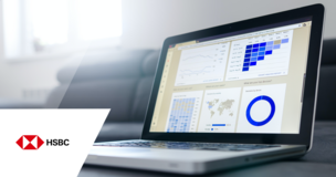 Otwarty laptop z wykresami i logiem firmy HSBC