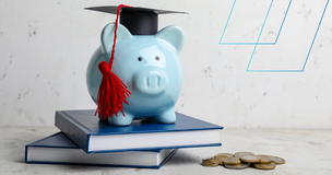 Piggy bank with graduation cap placed on books, symbolizing awarded student scholarships.