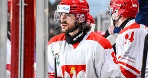 Ice hockey player in Poland’s national team uniform on the rink during the Winter Universiade.
