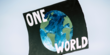 plakat z ziemią i napisem ONE WORLD