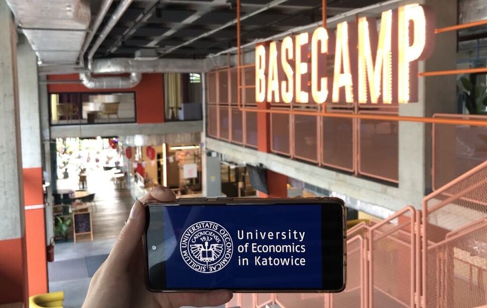 phone displaying UE Katowice logo 