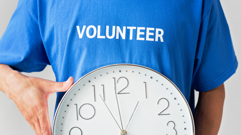 A man in a volunteer t-shirt 