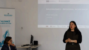 Woman presenting at the Bauhaus4EU regional workshop with presentation slide in the background.